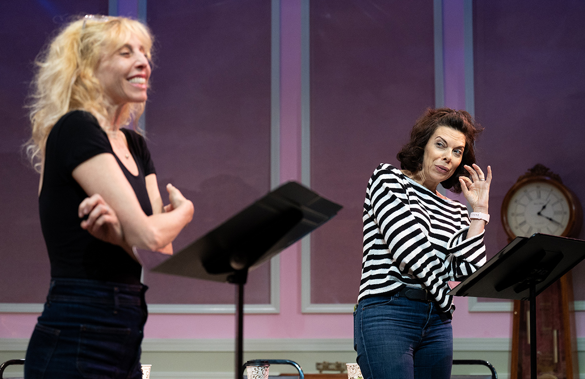 Two women read the script of Cannabis Passover